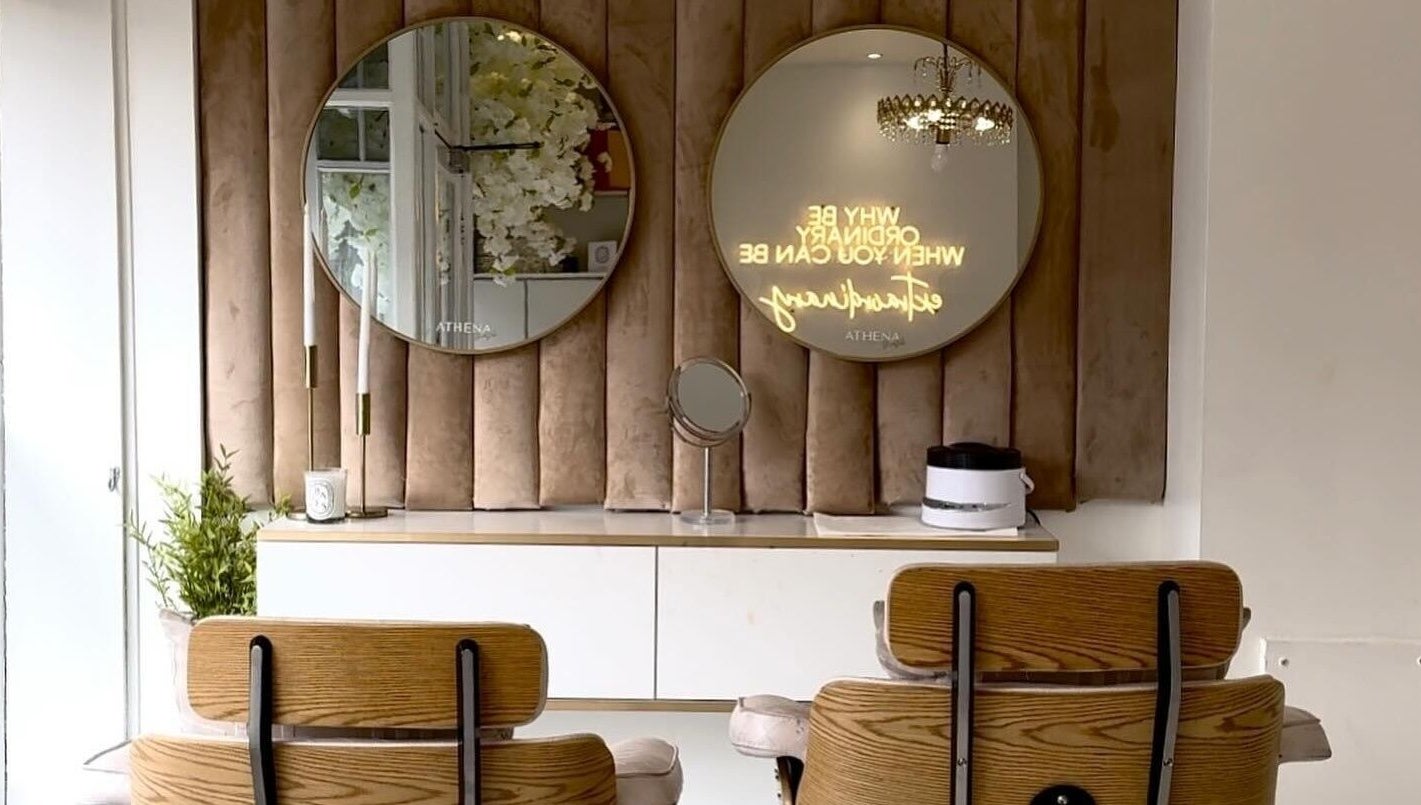 Elegant beauty room at Athena Mortlake, London, England, GB with stylish mirrors and chic decor.