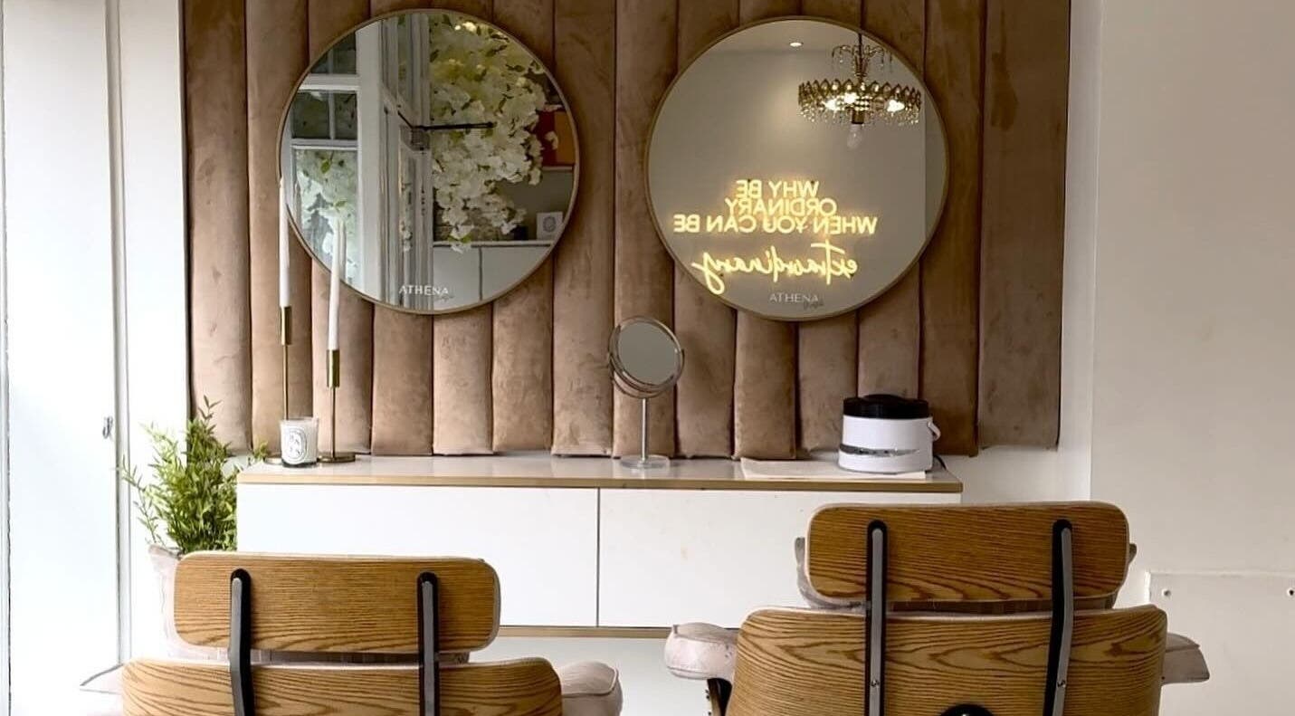 Elegant beauty room at Athena Mortlake, London, England, GB with stylish mirrors and chic decor.