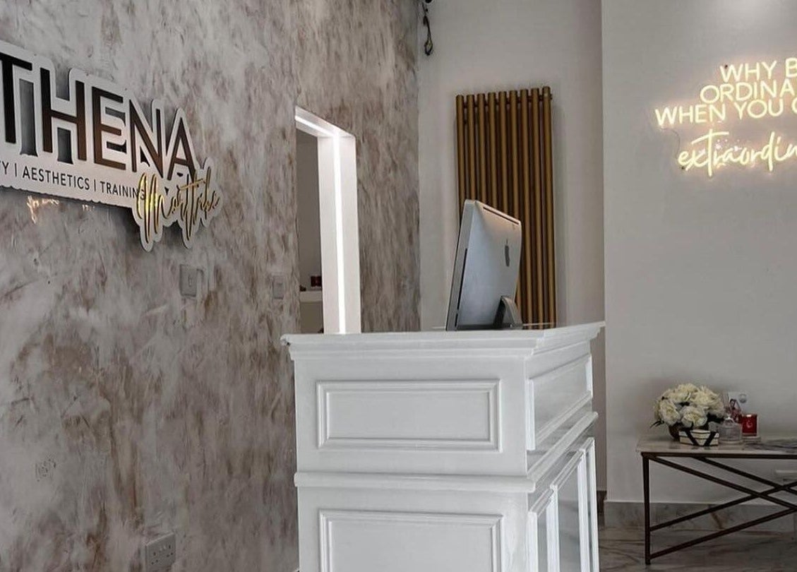 Reception at Athena Mortlake in London, England, GB featuring elegant decor and inspirational signage.