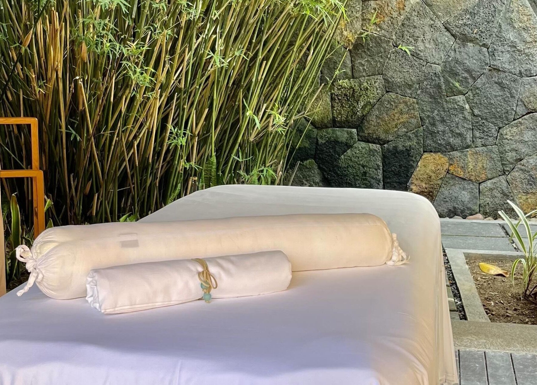 Outdoor spa table surrounded by bamboo at Living Well with Milly, Hereford, England, GB.