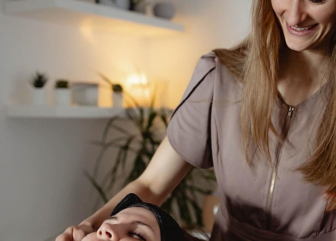 Therapist at Living Well with Milly in Hereford, England, GB providing a relaxing facial treatment.