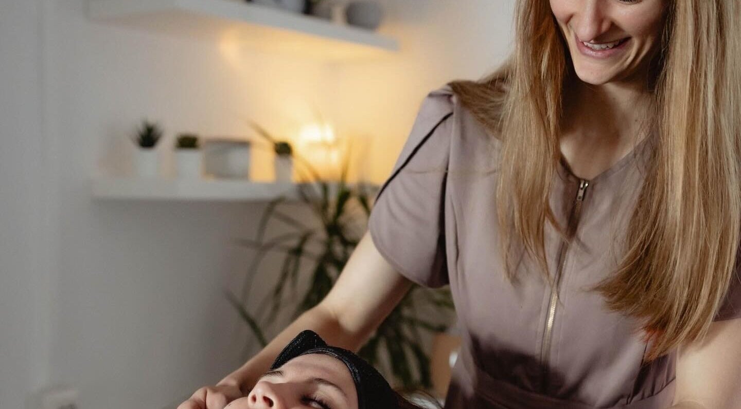 Therapist at Living Well with Milly in Hereford, England, GB providing a relaxing facial treatment.