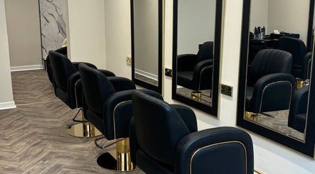 Stylish salon chairs and mirrors at MUSE, Greenock, Scotland, GB, showcasing a chic and modern interior.