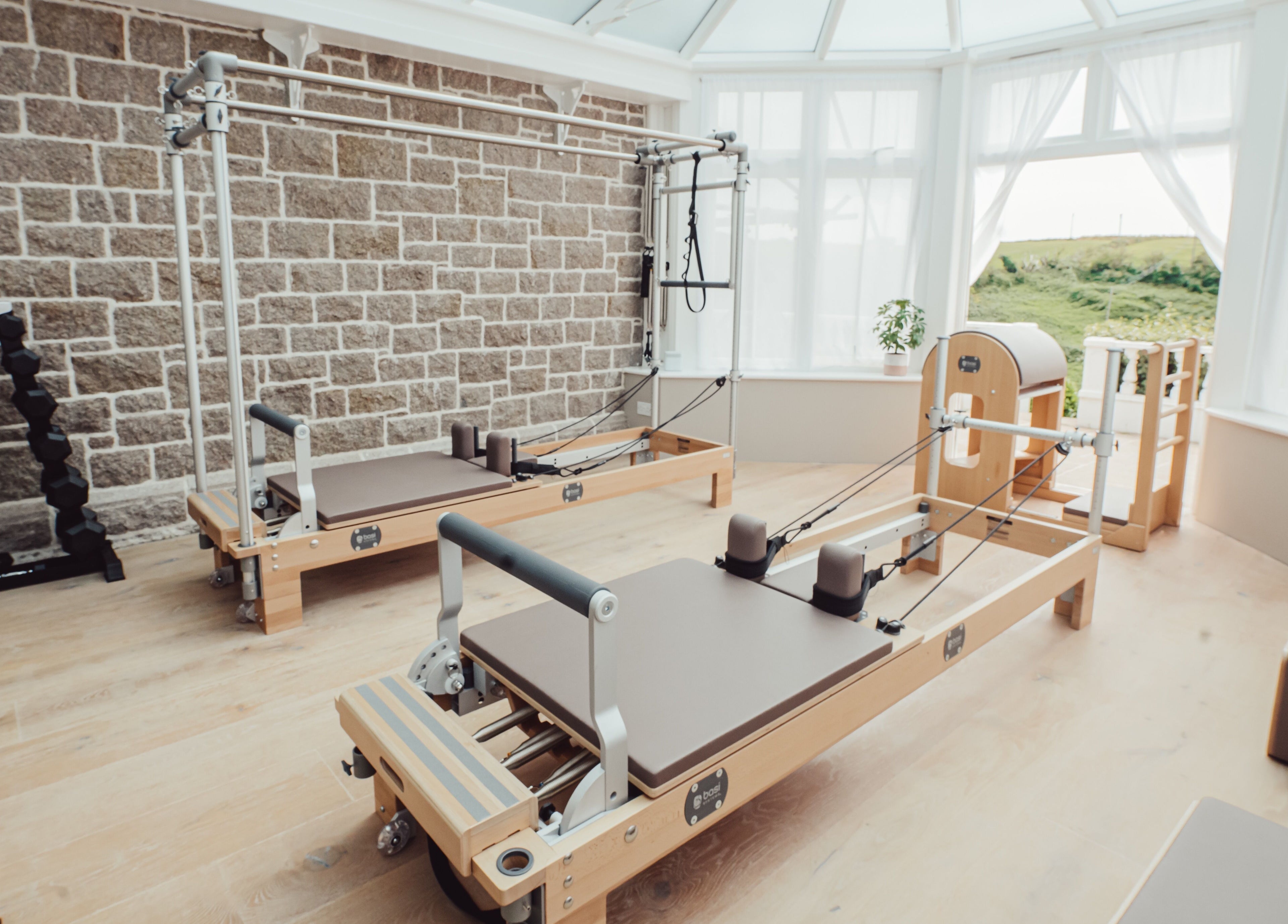 Pilates equipment at Reform Pilates ~ Rebecca Middleton in St. Ouen, Jersey, JE. Bright and serene workout space.