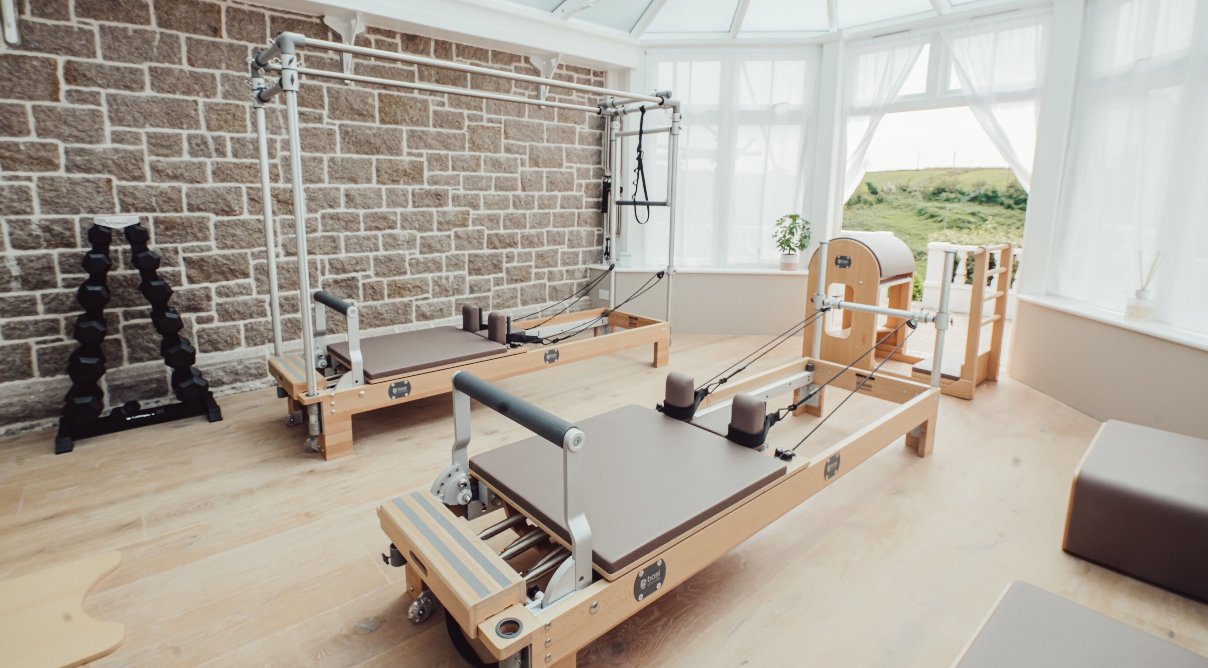 Pilates equipment at Reform Pilates ~ Rebecca Middleton in St. Ouen, Jersey, JE. Bright and serene workout space.