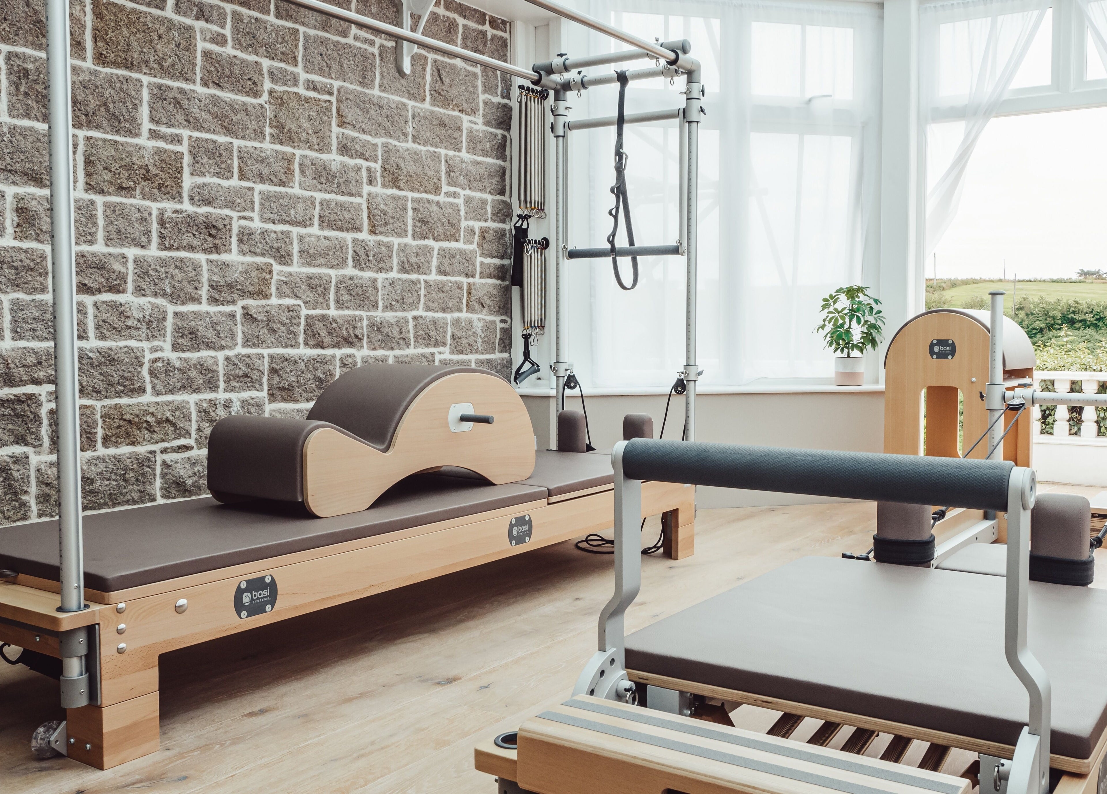 Pilates equipment at Reform Pilates ~ Rebecca Middleton in St. Ouen, Jersey. A tranquil and inviting setup.