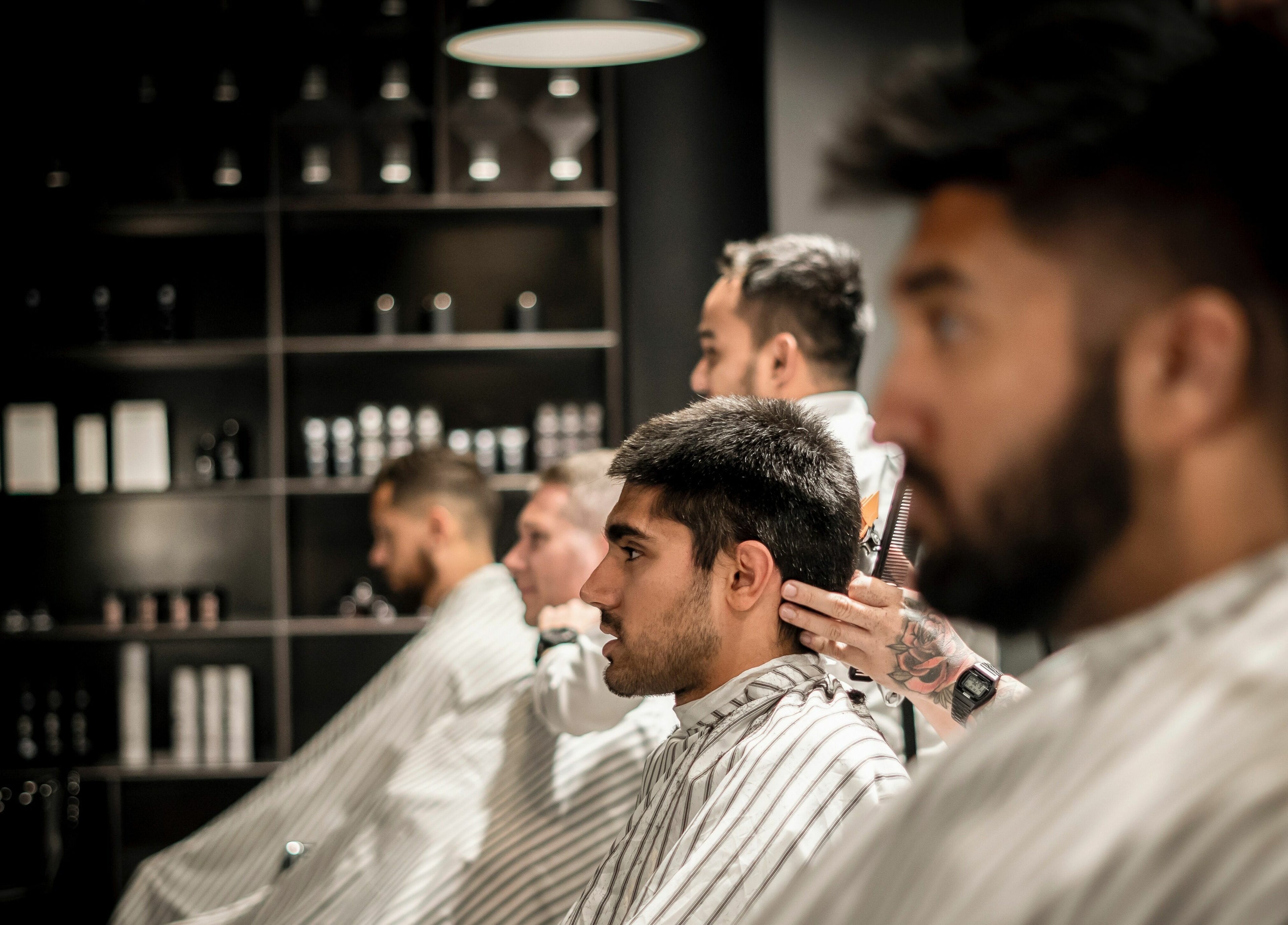 Clients receiving trendy haircuts at Chaps & Co Dubai Design District D3, Dubai, AE.