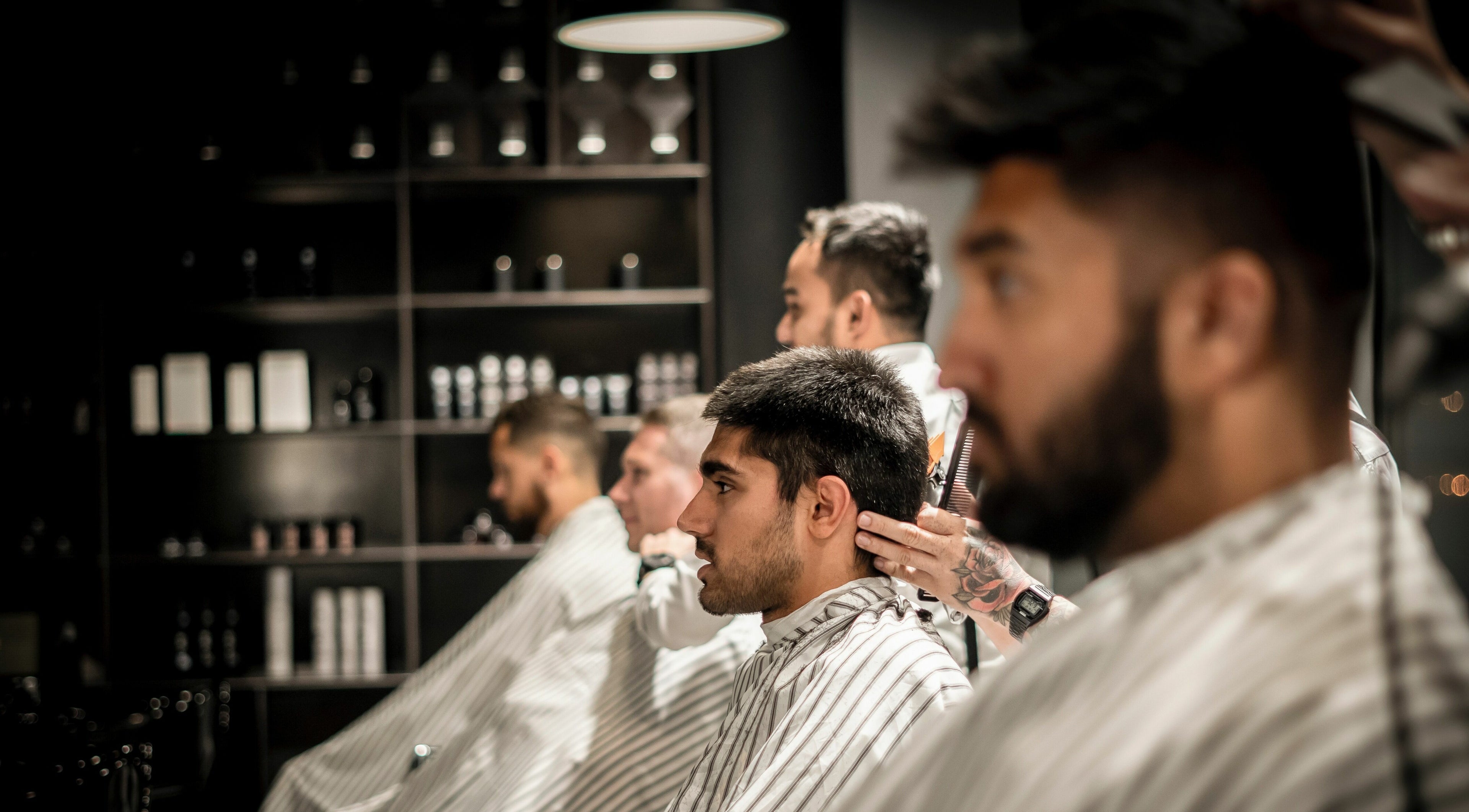 Clients receiving trendy haircuts at Chaps & Co Dubai Design District D3, Dubai, AE.