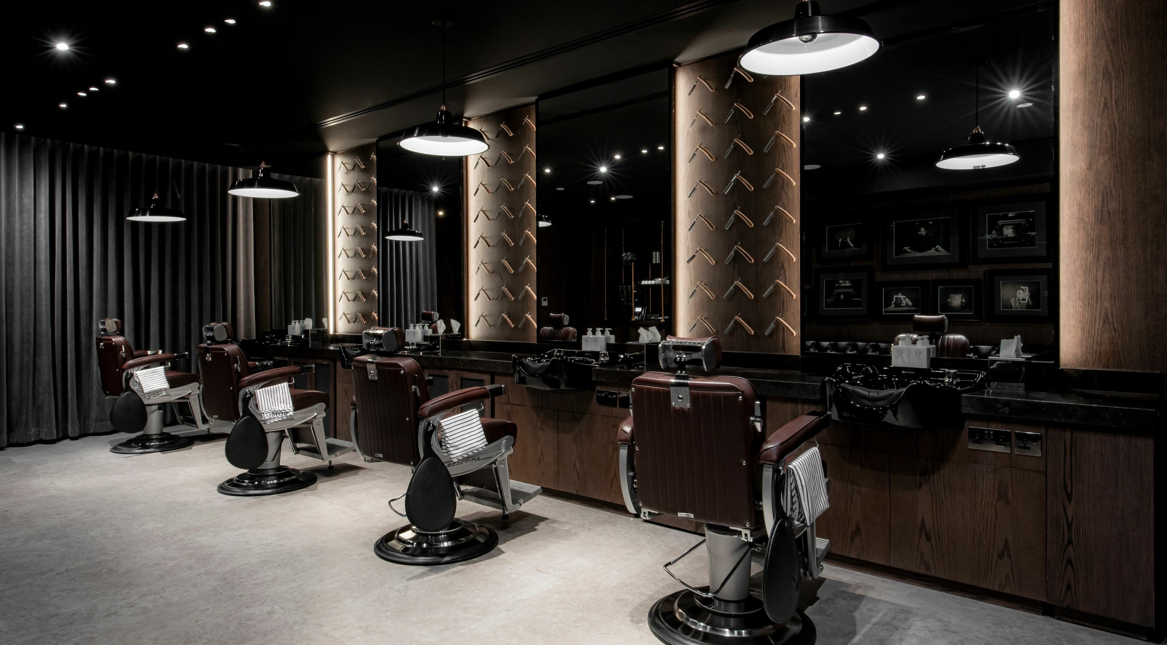 Elegant interior of Chaps & Co Edition Hotel Al Bateen Marina, Abu Dhabi, featuring premium barber chairs and decor.
