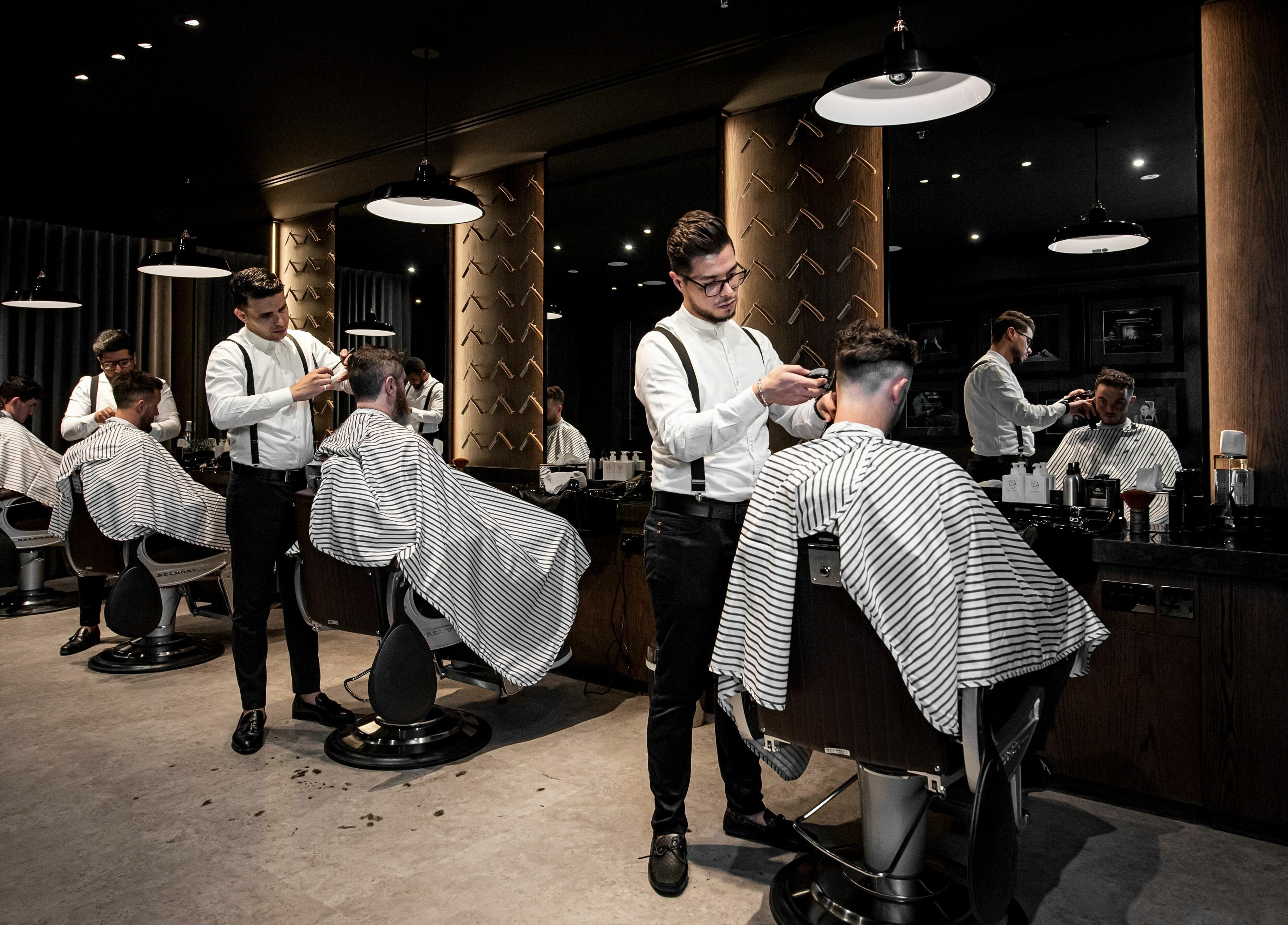 Barbers at Chaps & Co Edition Hotel Al Bateen Marina, Abu Dhabi providing haircuts with precision and style.