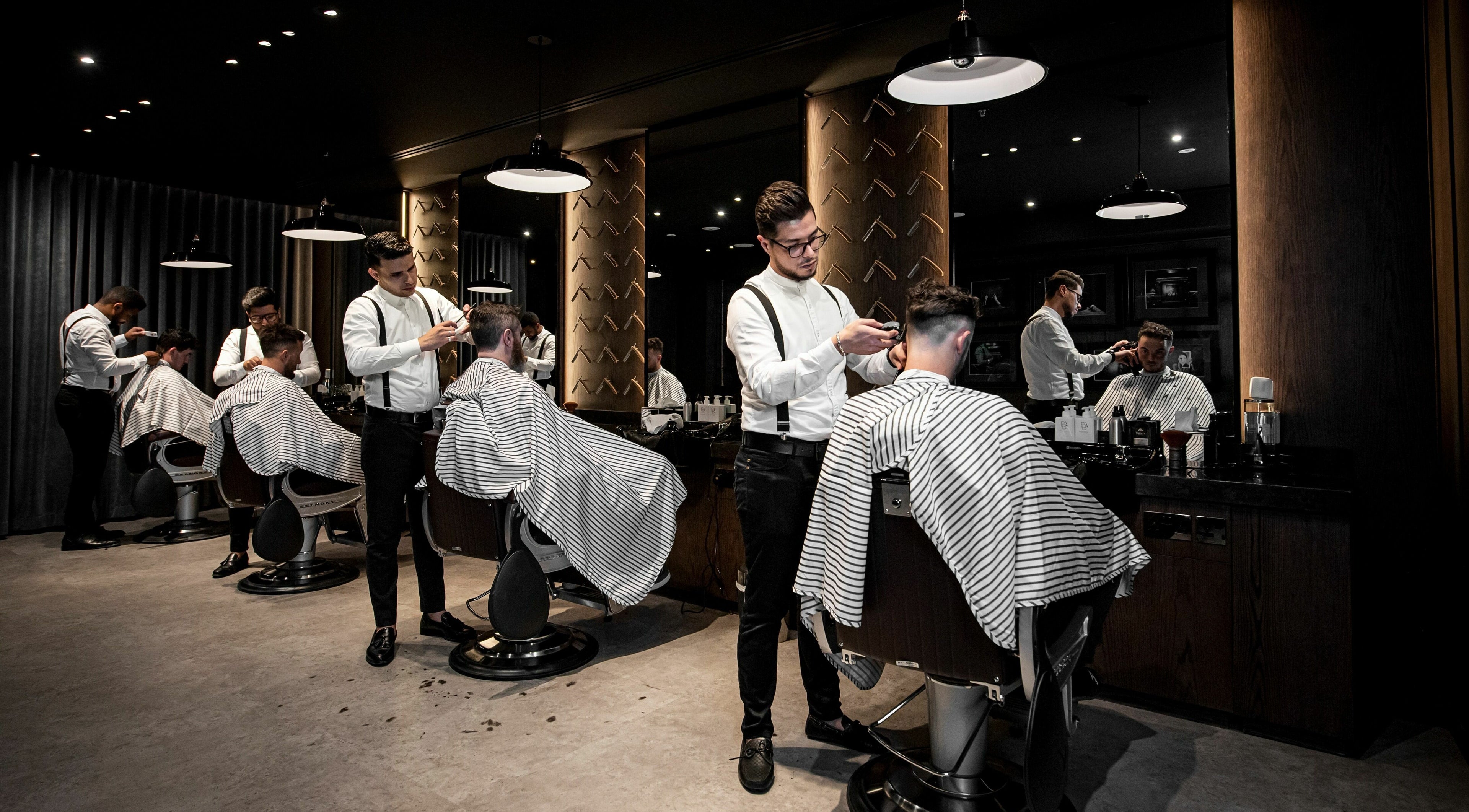 Barbers at Chaps & Co Edition Hotel Al Bateen Marina, Abu Dhabi providing haircuts with precision and style.