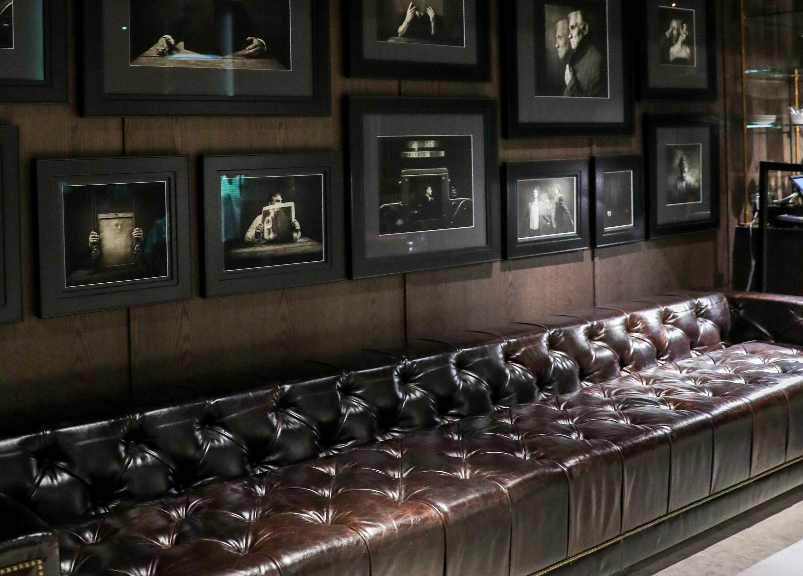 Chic leather sofa with vintage photos at Chaps & Co Edition Hotel Al Bateen Marina, Abu Dhabi, Abu Dhabi, AE.