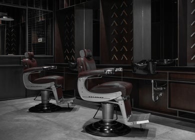 Luxurious barber chairs inside Chaps & Co - Bloomingdale's, Dubai, Dubai, AE. Stylish and sophisticated interior.