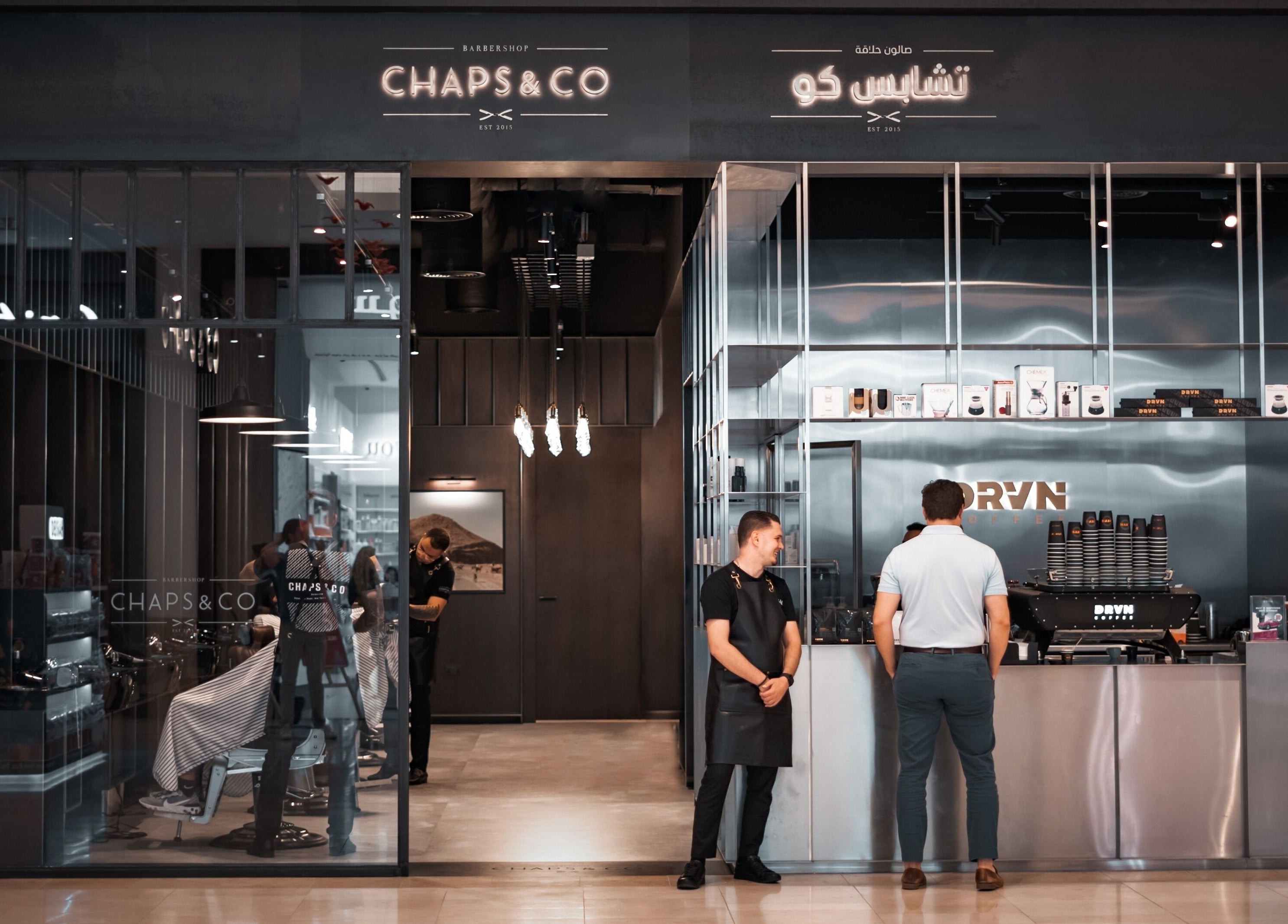 Entrance to Chaps & Co Yas Mall barbershop in Abu Dhabi, AE, showcasing modern design and inviting ambiance.