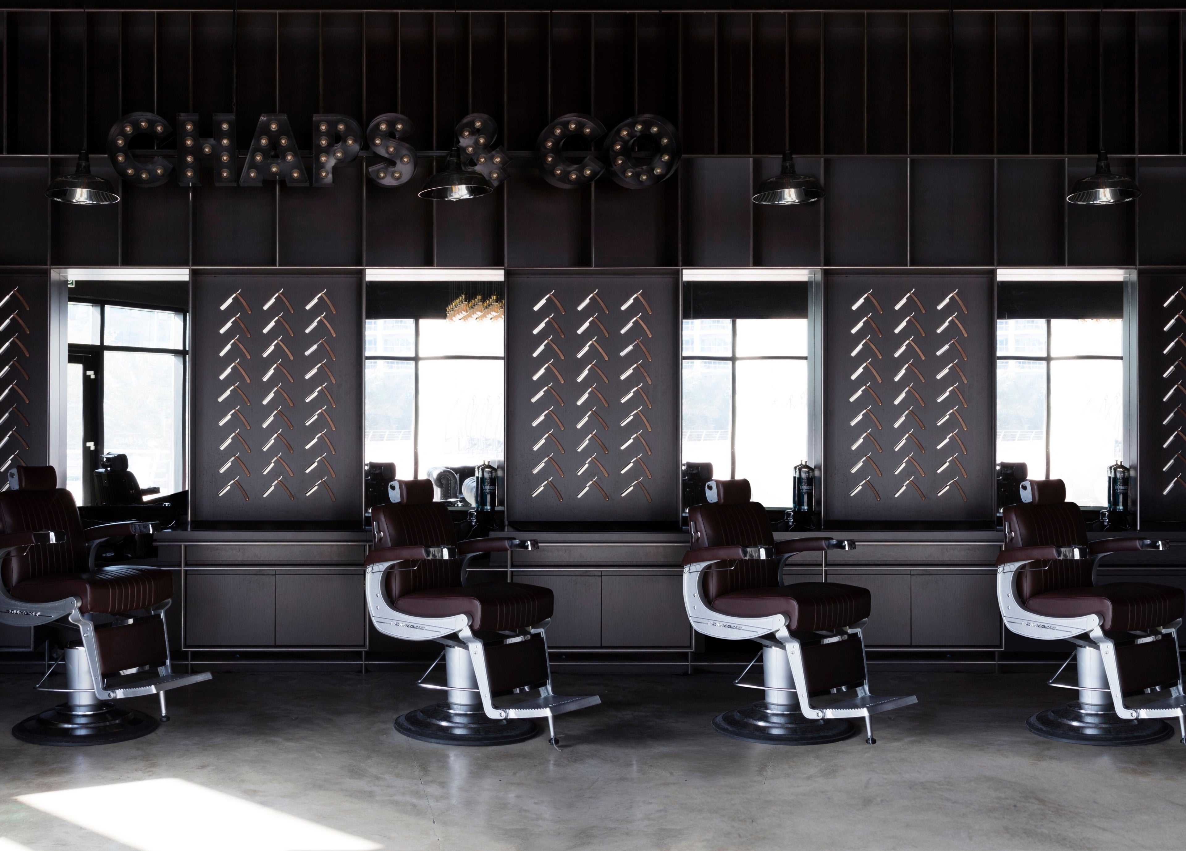 Modern barber chairs at Chaps & Co - Reform at the Lakes, Dubai, Dubai, AE. Chic interior design.