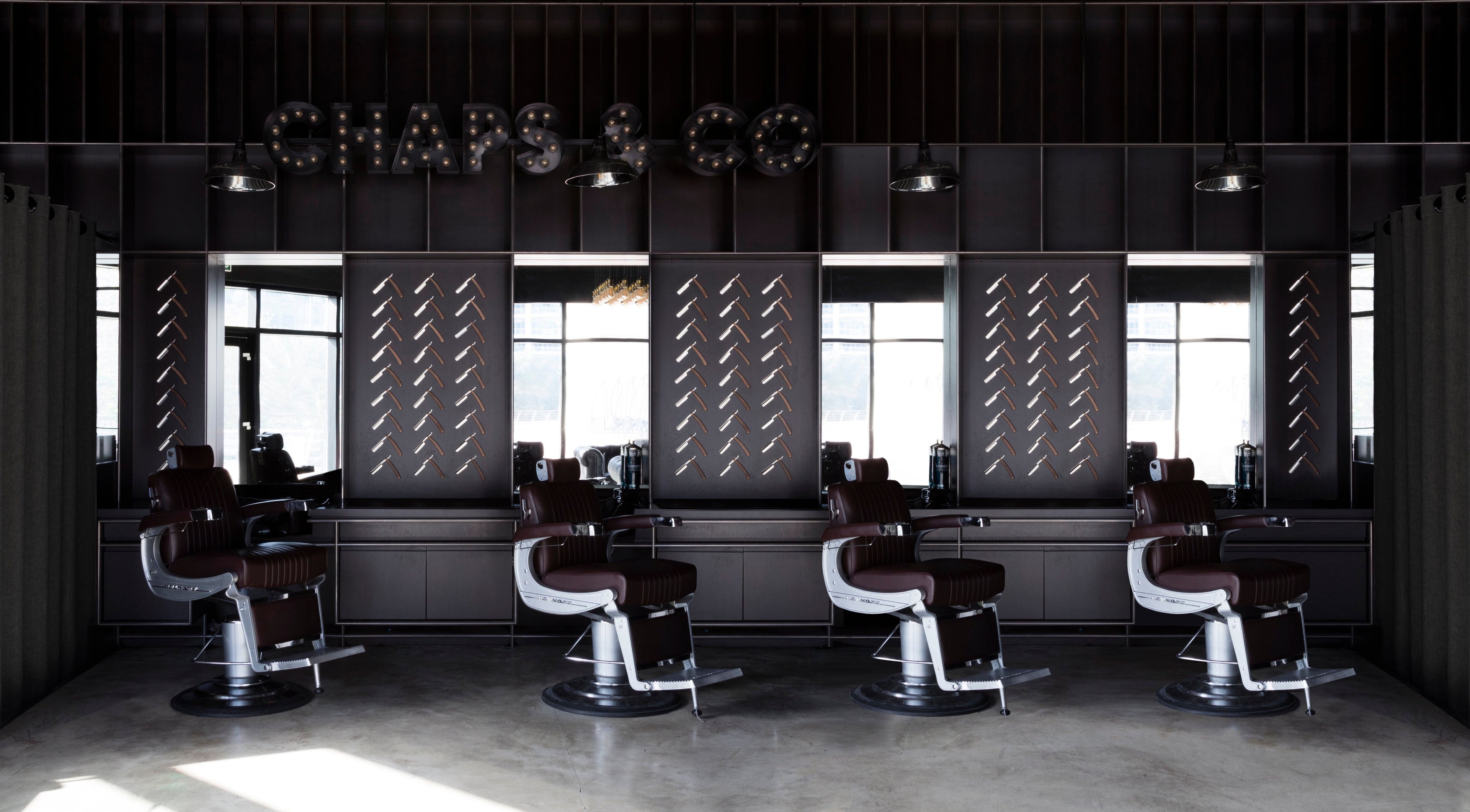 Modern barber chairs at Chaps & Co - Reform at the Lakes, Dubai, Dubai, AE. Chic interior design.