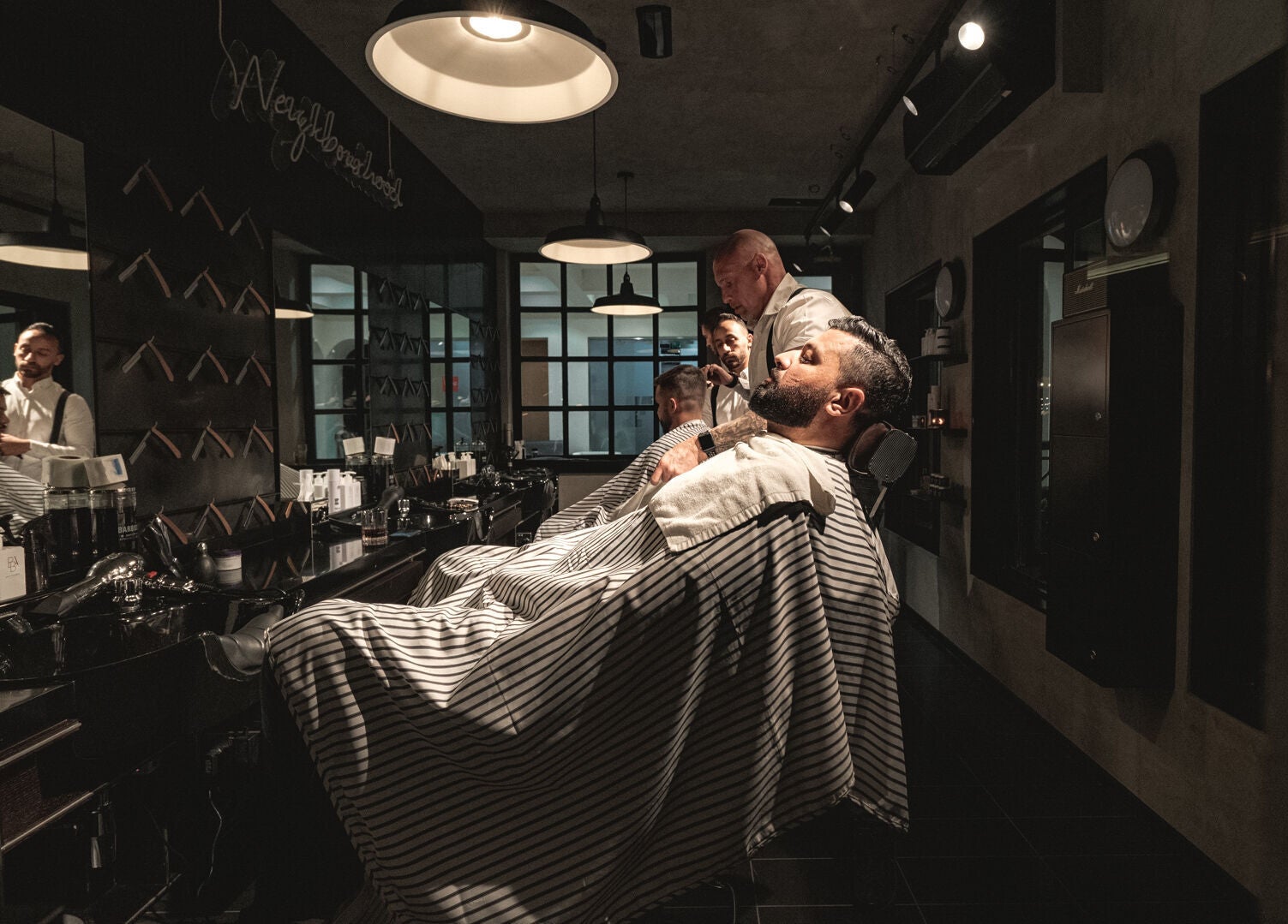 Stylish barbershop interior at Chaps & Co - Reform at the Lakes, Dubai, Dubai, AE offering expert grooming services.