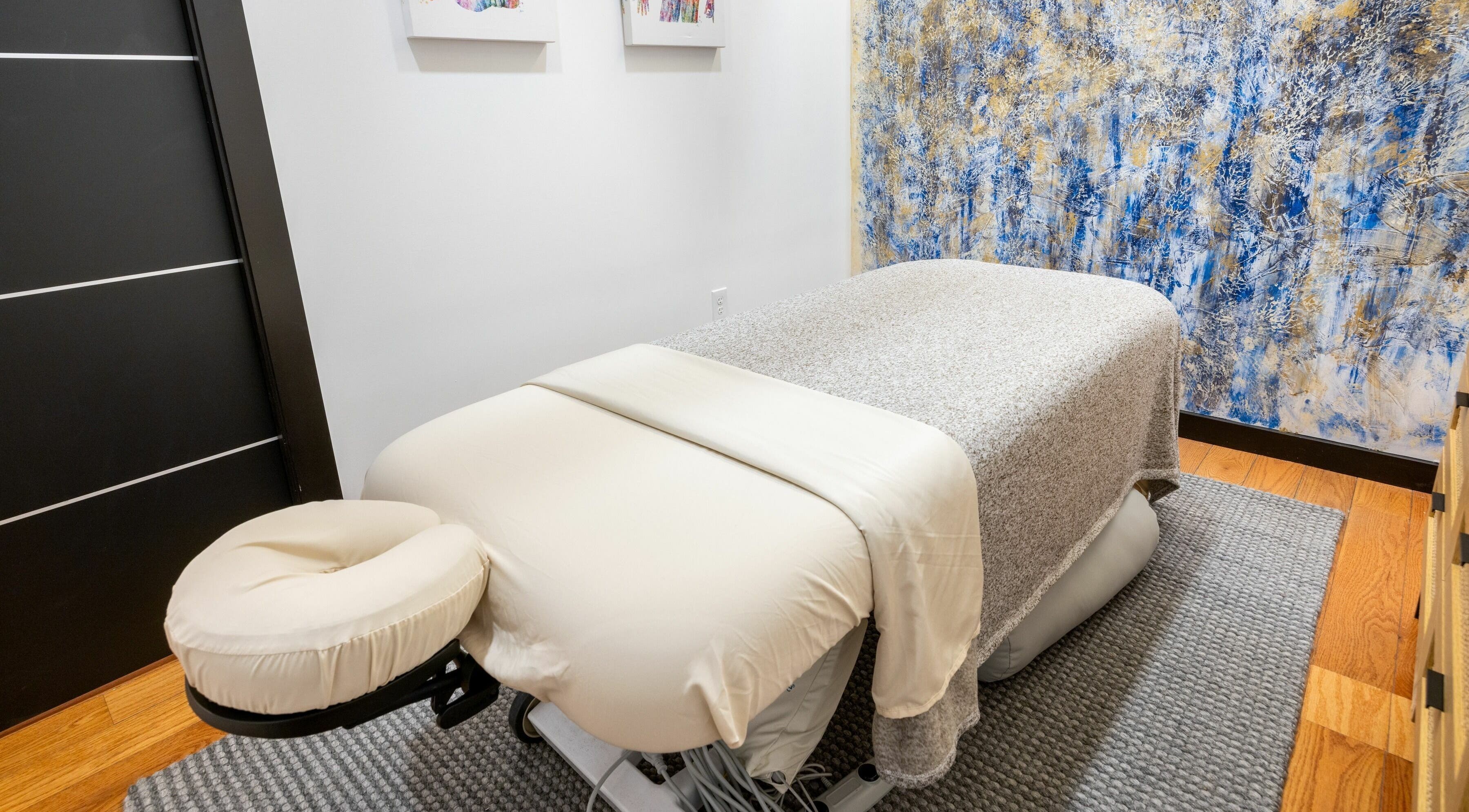 Cozy massage room at BAMBAT Advanced Thai Massage, Brookline, Massachusetts, US with serene decor.