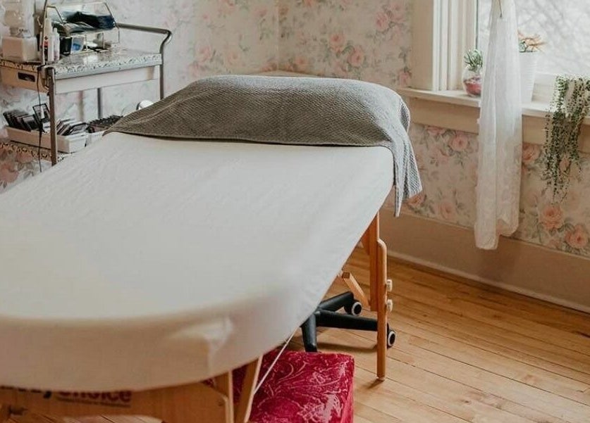 Massage room at Solorzano Spa Ltd, Red Deer, Alberta, CA, featuring a treatment table and calming decor.