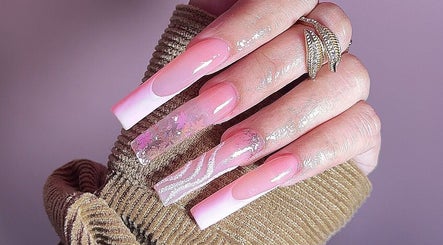 Stunning pink acrylic nails at Lash Infinity, Miller, New South Wales, AU, showcasing elegant nail art designs.