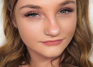 Close-up of woman's face showcasing eyelash extensions at Lash Infinity, Miller, New South Wales, AU.
