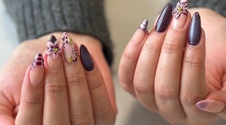 Detailed nail art at Milk and Honey Nail Studio, Hamilton, Waikato Region, NZ showcasing floral designs.