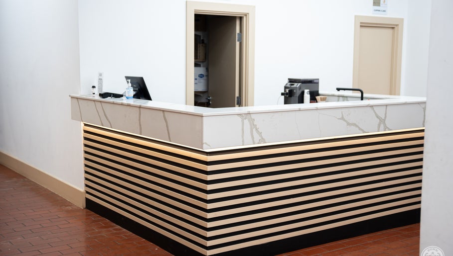 Stylish reception desk at ZONE RECOVERY in London, England, GB, featuring minimalist design.