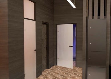 Modern entrance hallway at ZONE RECOVERY, London, England, GB, showcasing sleek design and warm lighting.