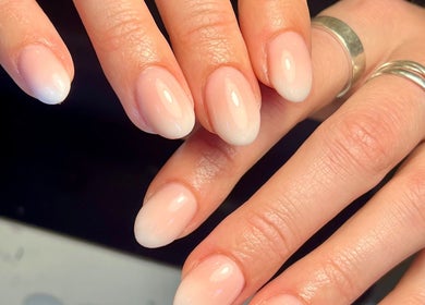 Freshly manicured nails with a natural ombre finish at Beauty By Phoebs, Reigate, England, GB.