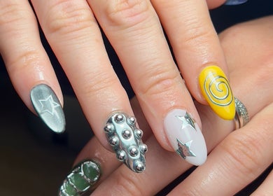 Stylish manicure with star and swirl designs at Beauty By Phoebs, Reigate, England, GB.