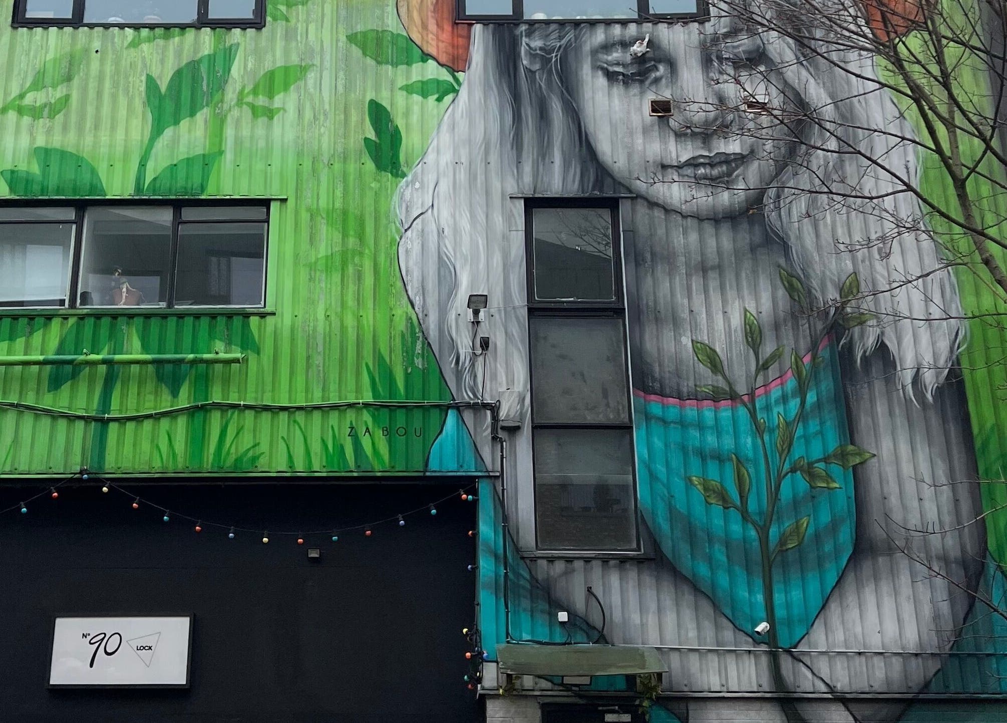 Colorful mural outside Beauty By Phoebs - Hackney in London, England, GB creates an artistic ambiance.