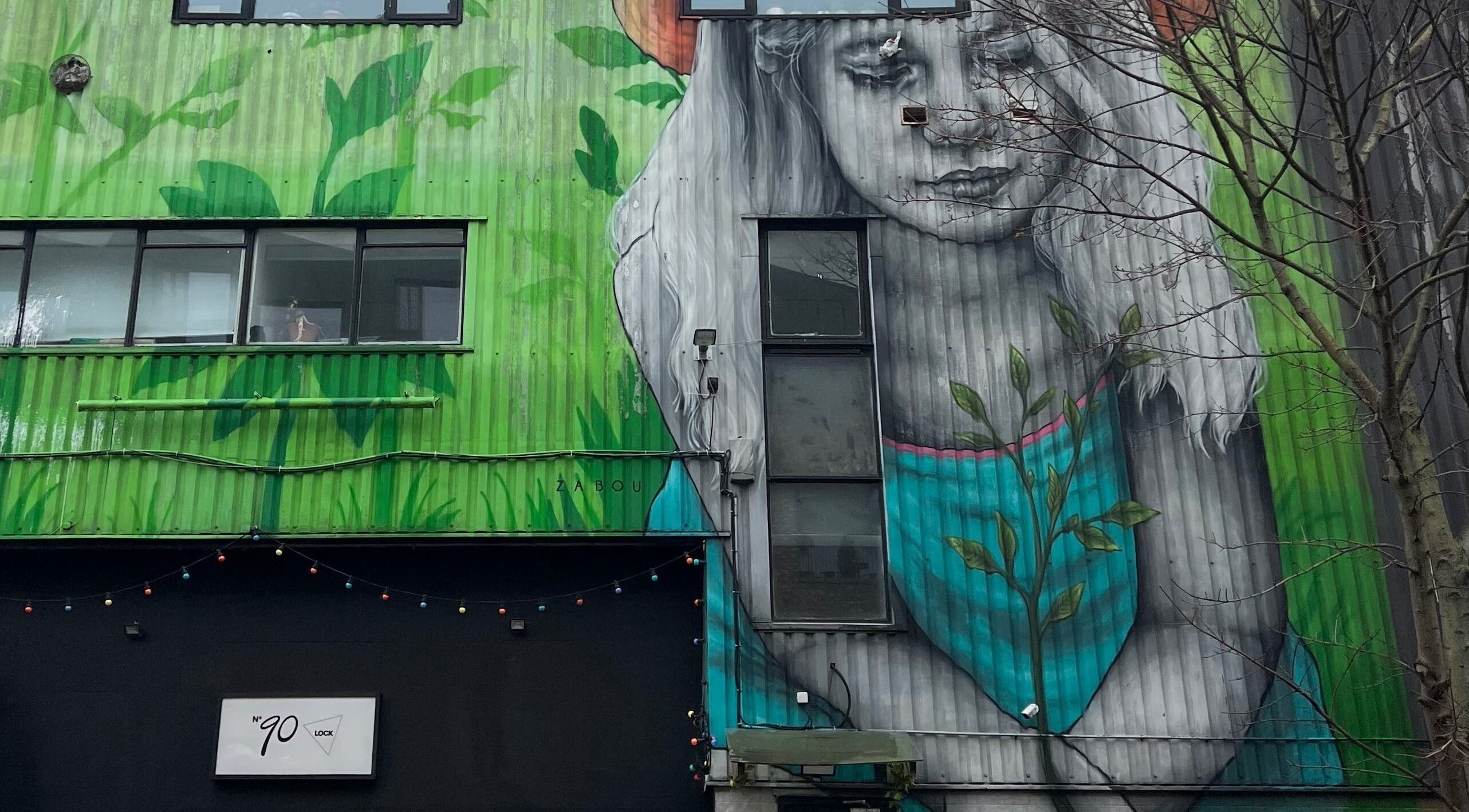 Colorful mural outside Beauty By Phoebs - Hackney in London, England, GB creates an artistic ambiance.