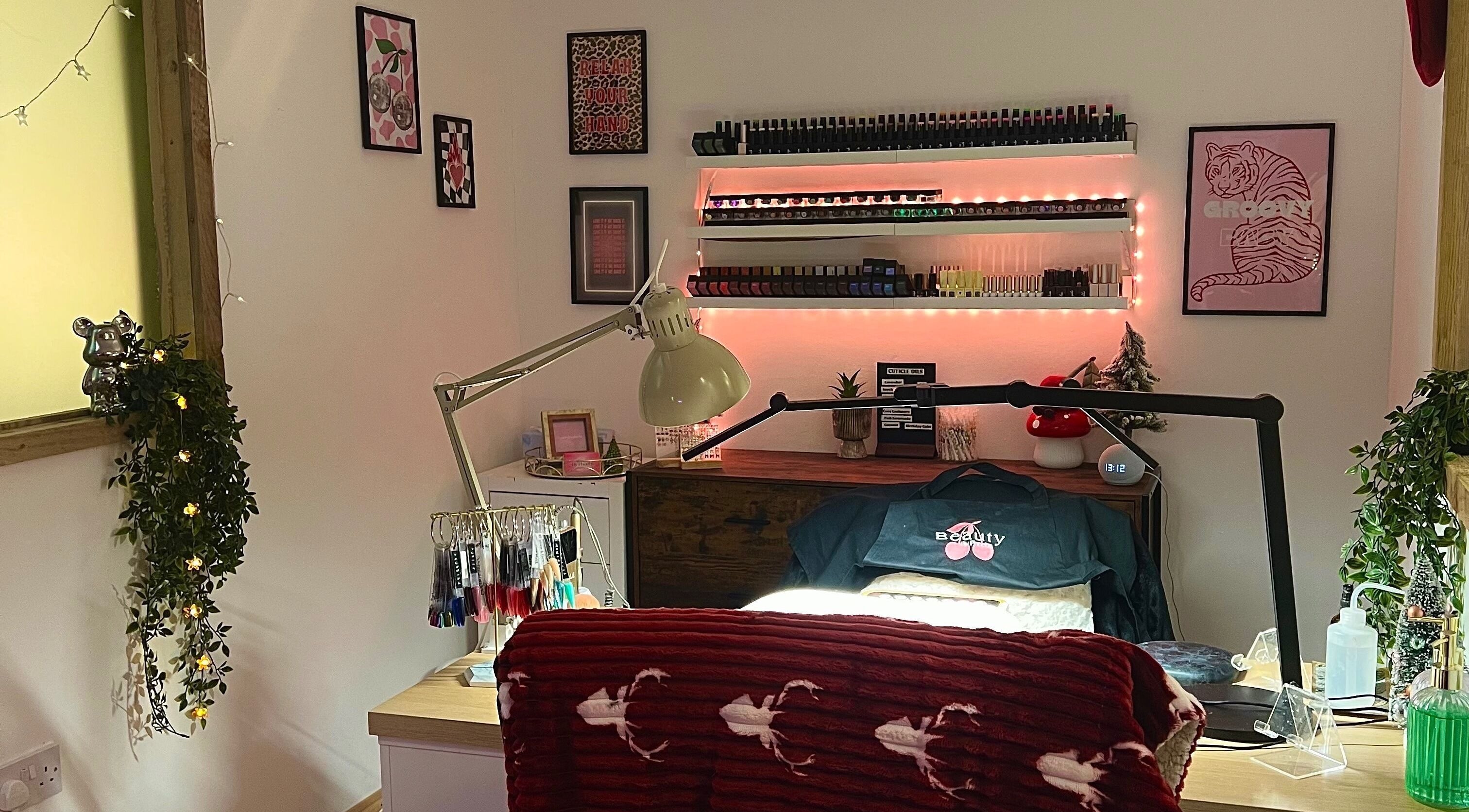 Cozy nail studio at Beauty By Phoebs - Hackney, in London, England, GB featuring elegant decor and ambient lighting.