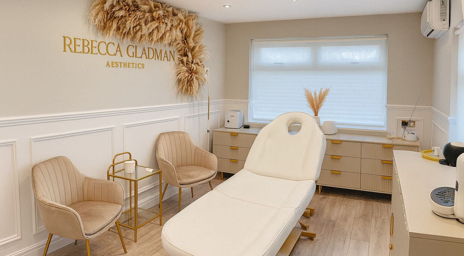 Elegant treatment room at Rebecca Gladman Aesthetics in Kings Langley, England, featuring modern decor.