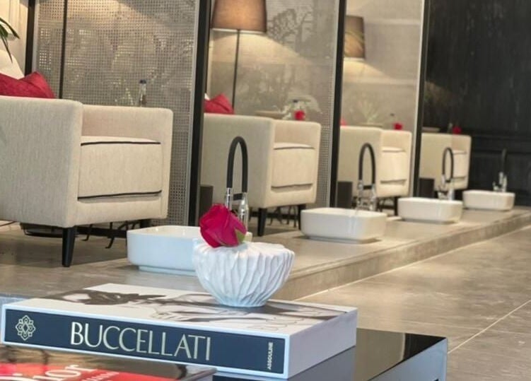 Chic seating area at Sw Salon in Riyadh, Riyadh Province, SA, featuring plush chairs and stylish decor.