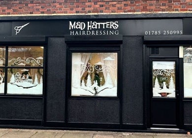 Mad Hatters Hairdressing entrance with festive decor in Stafford, England, GB.
