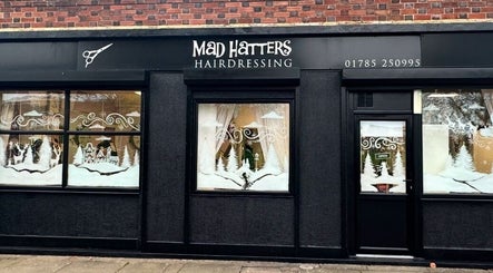 Mad Hatters Hairdressing entrance with festive decor in Stafford, England, GB.
