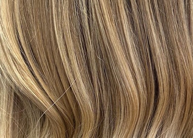 Elegant blonde waves styled at Mad Hatters Hairdressing in Stafford, England, GB.