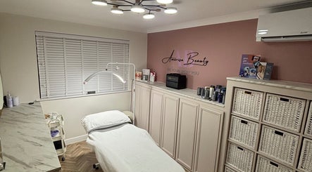 Relaxing treatment room at Amarisa Beauty, Berwick, England, GB, featuring a cozy bed and stylish lighting.