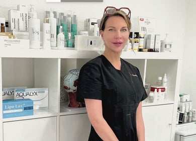 Beauty specialist at iBeautify, Royal Tunbridge Wells, GB, with skincare products display.