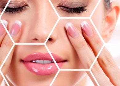Close-up of a woman's face and nails at I Beautify, Royal Tunbridge Wells, GB.