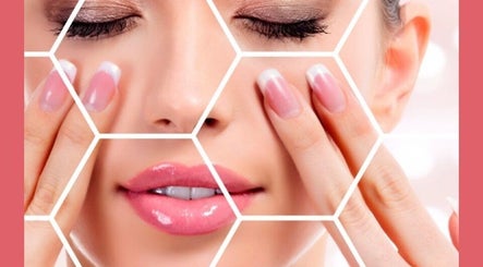 Close-up of a woman's face and nails at I Beautify, Royal Tunbridge Wells, GB.