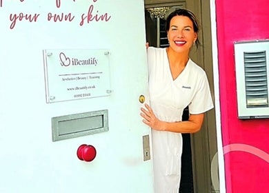Smiling staff member welcomes at I Beautify, Royal Tunbridge Wells, GB, enhancing beauty experience.