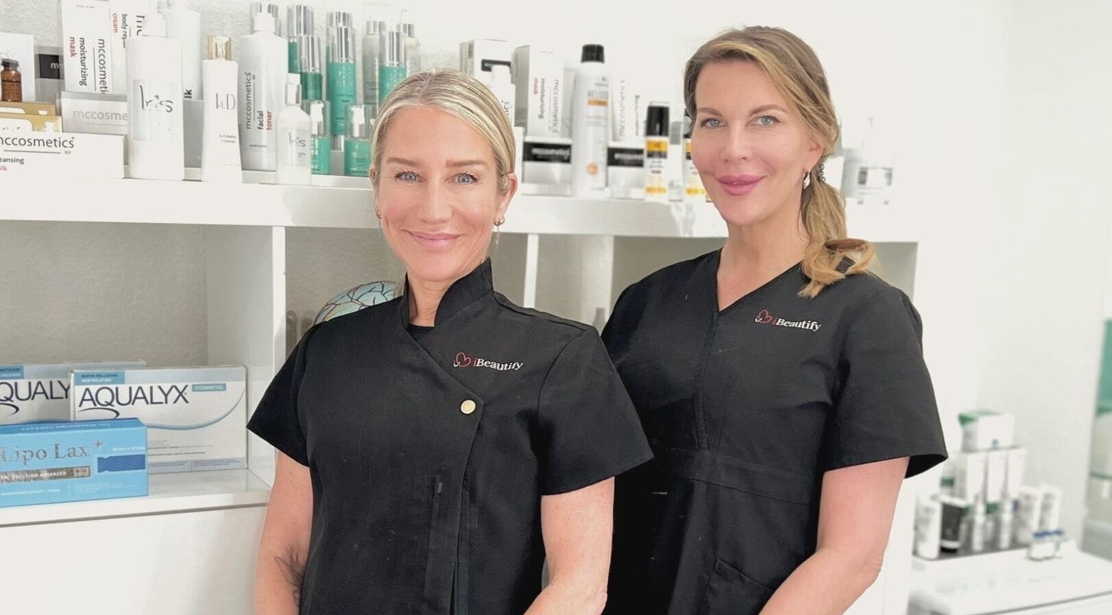 I Beautify professionals at Royal Tunbridge Wells, GB, with skincare products on display.