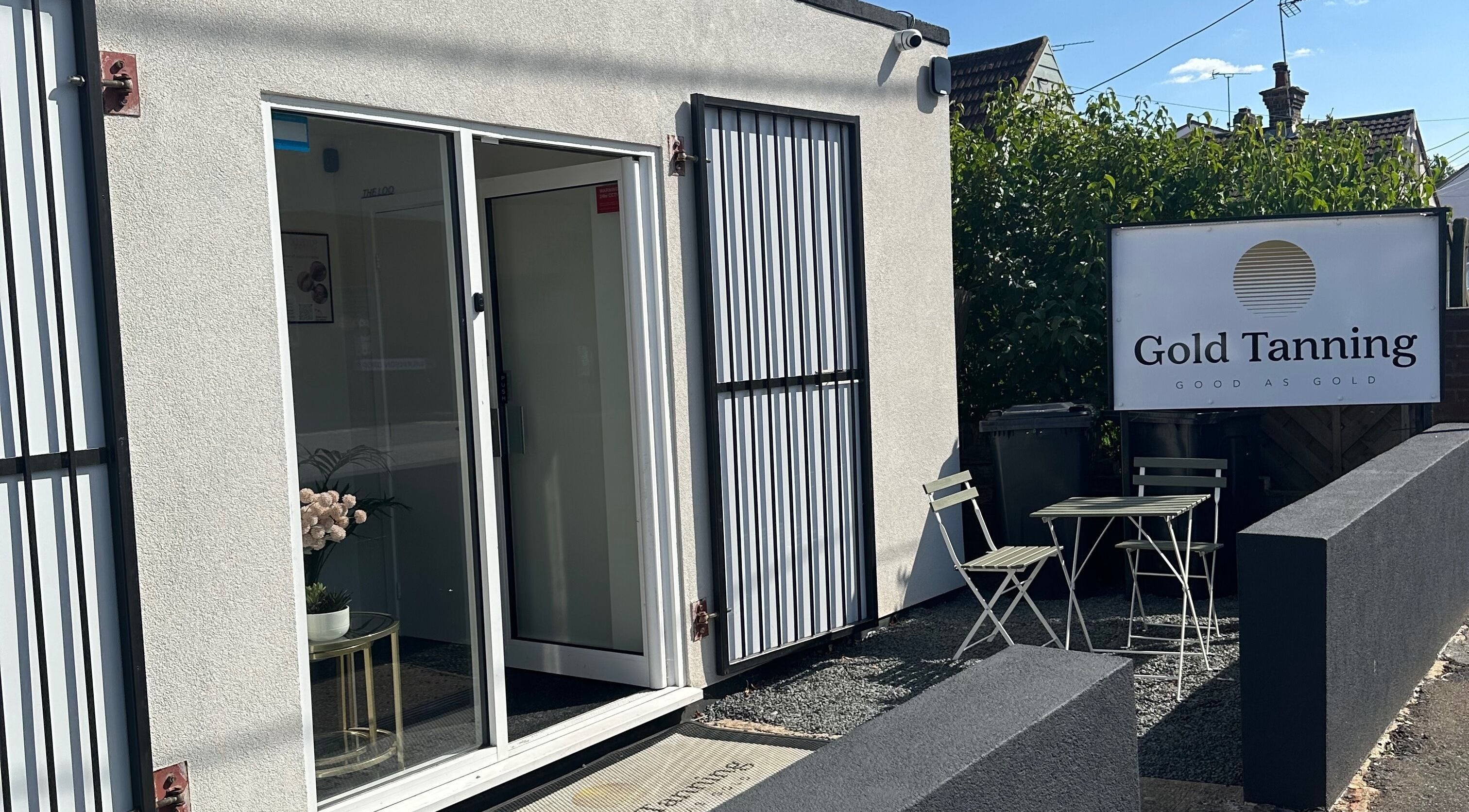 Modern exterior of Dolled Up by Alex in Hadleigh, England, GB, featuring a sleek entrance and welcoming patio.