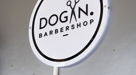 Sign of Dogan Barbershop in Stavanger, Rogaland, NO, showcasing stylish branding.