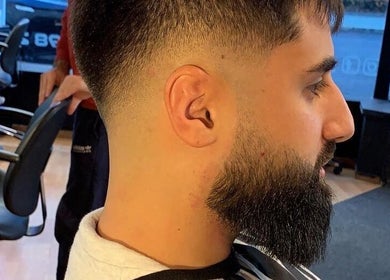 Stylish fade haircut at Dogan Barbershop, Stavanger, Rogaland, NO, showcasing precision barbering.