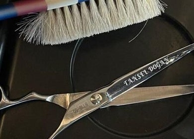 Professional barber scissors at Dogan Barbershop in Stavanger, Rogaland, NO, showcasing skilled craftsmanship.