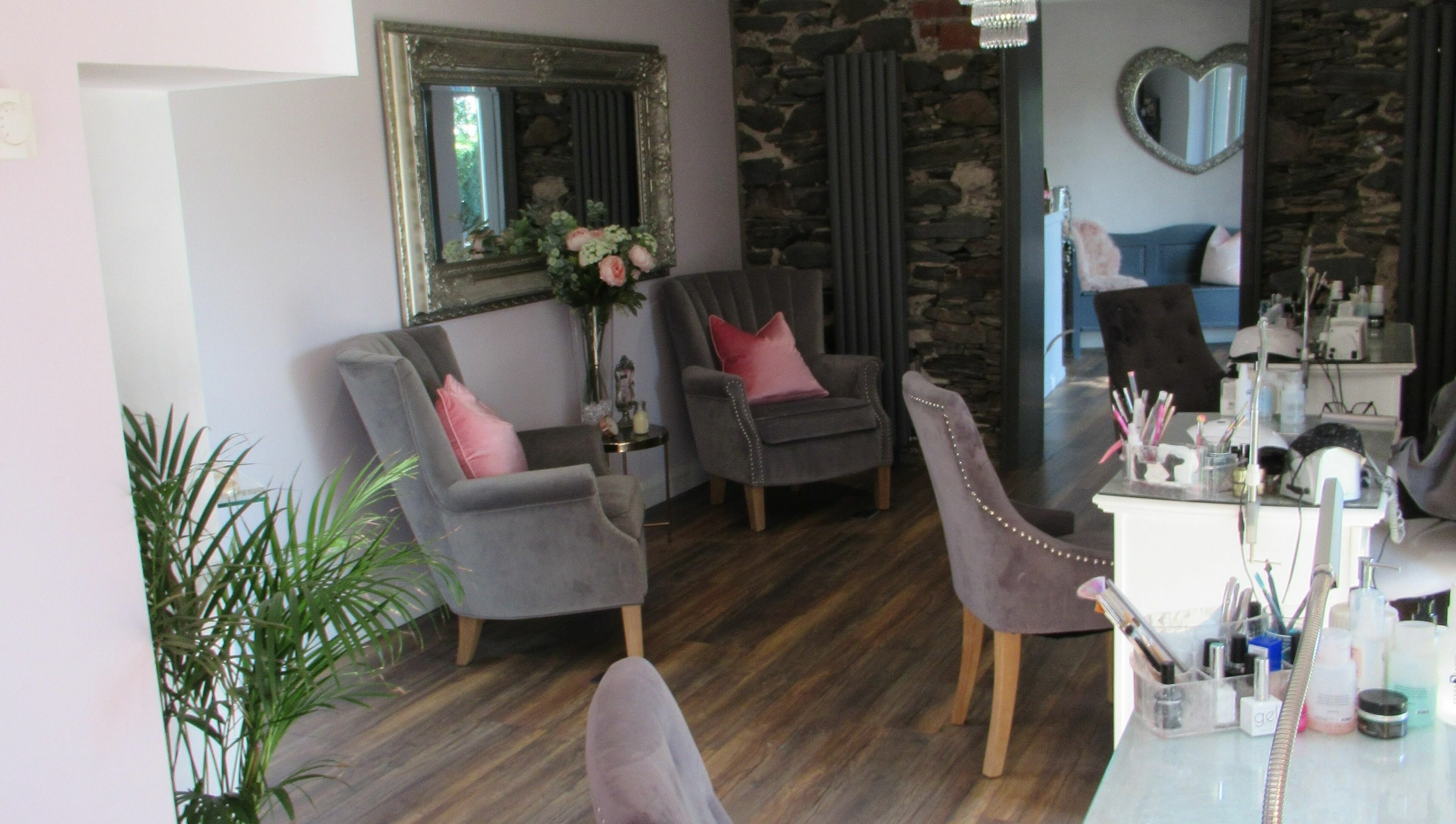 Elegant seating area at BeYOUtifi in Donaghadee, Northern Ireland, GB, with plush chairs and tasteful decor.