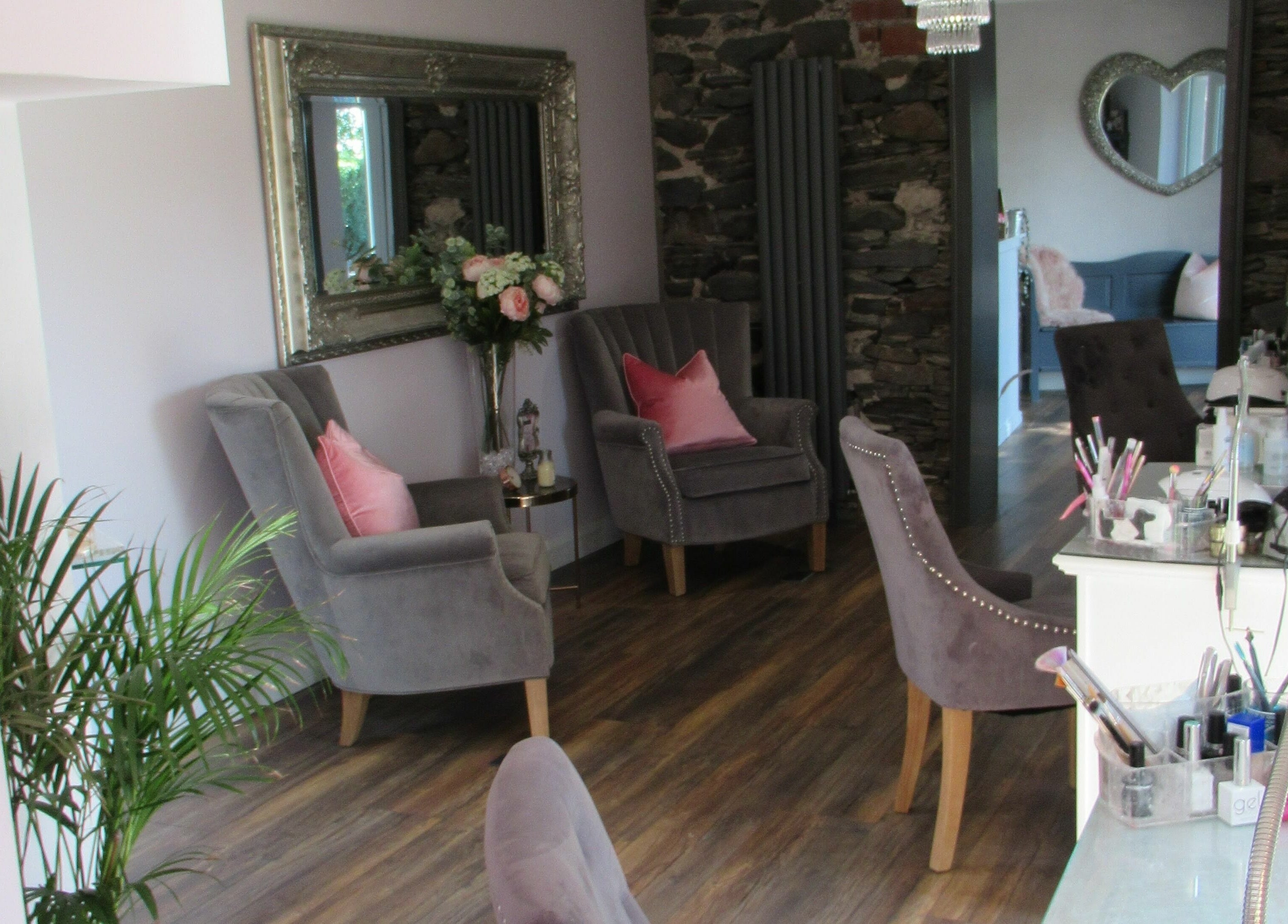 Elegant seating area at BeYOUtifi in Donaghadee, Northern Ireland, GB, with plush chairs and tasteful decor.